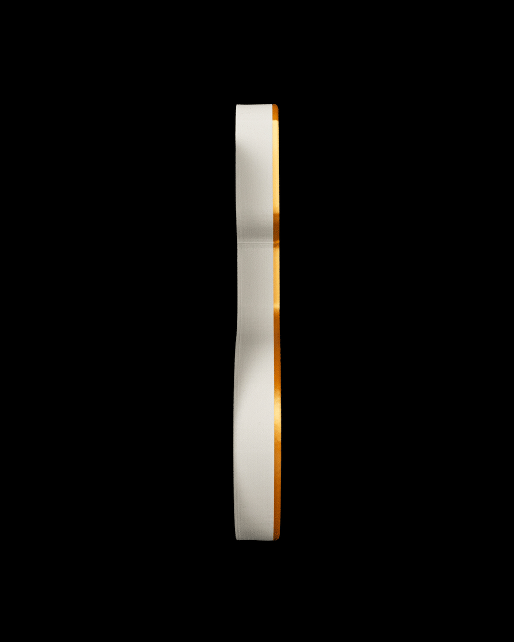 Edge view of the stocking tray showing its low profile, on a black background