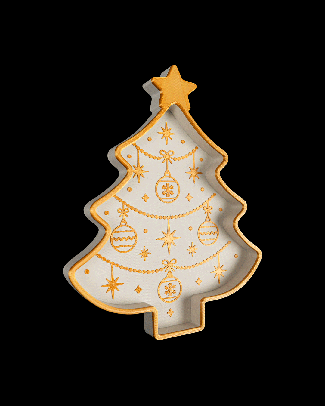 Angled view of the white and gold Christmas tree tray, on a black background
