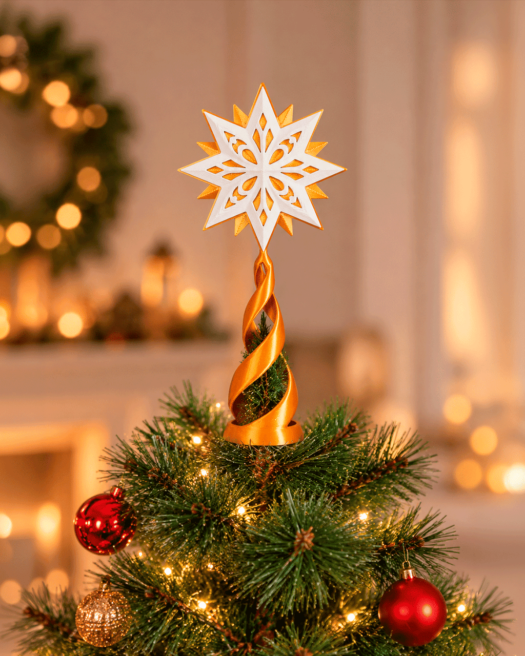 Custom colorway example: white and gold star topper on a gold spiral stand, on top of a lit Christmas tree