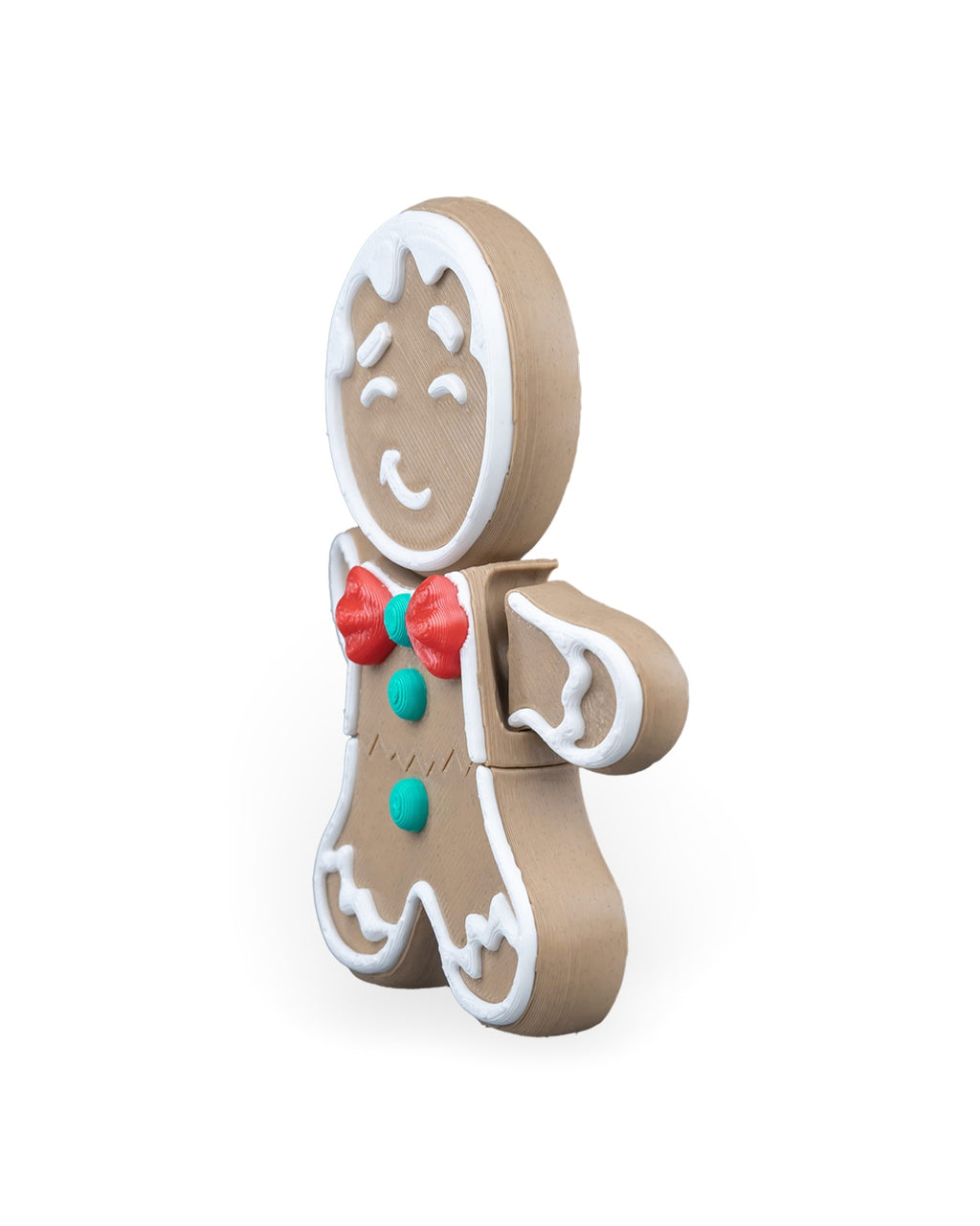 Gingerbread man Christmas ornament turned to the right, showing the red bow tie and green buttons, on a white background