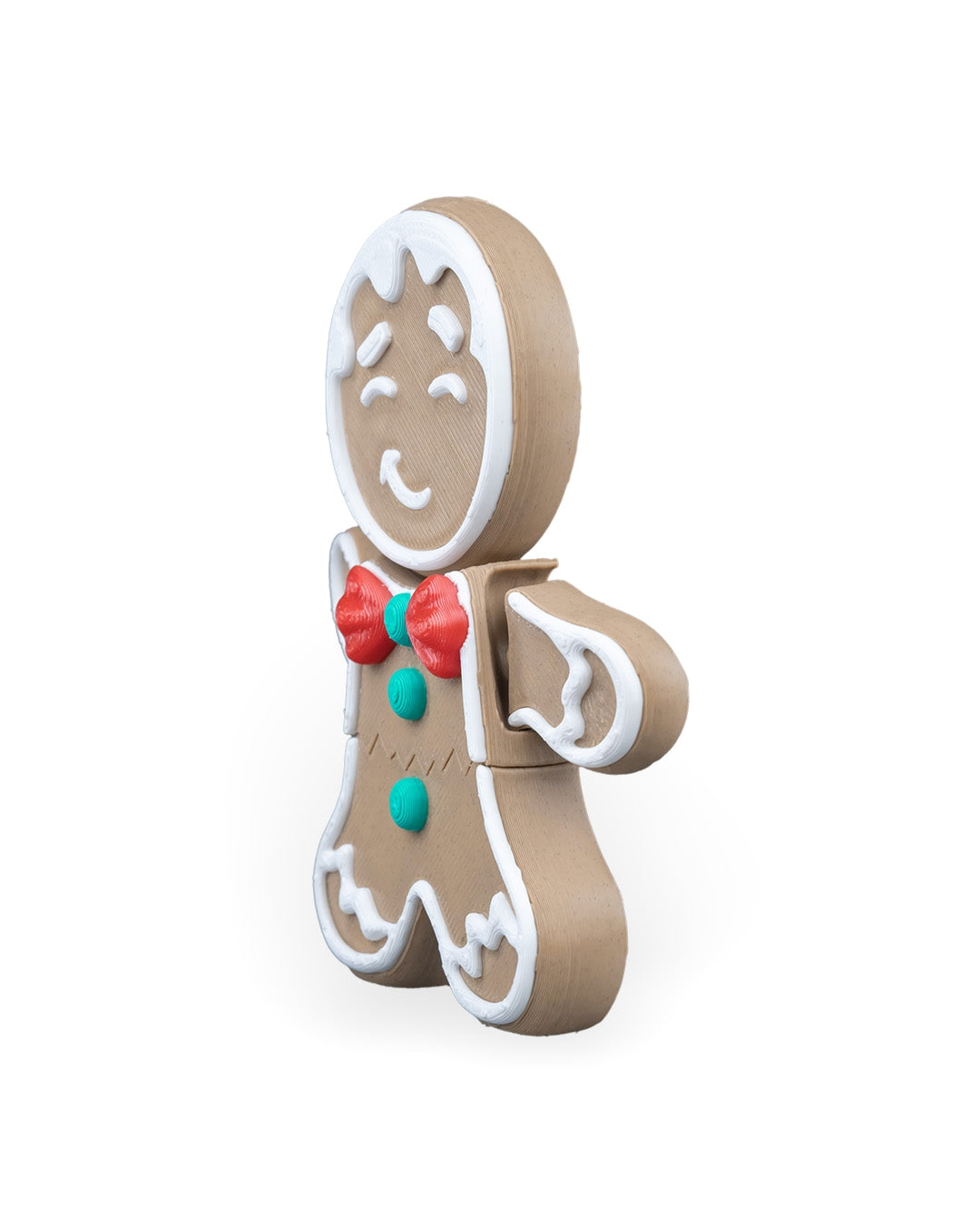 Gingerbread man Christmas ornament turned to the right, showing the red bow tie and green buttons, on a white background
