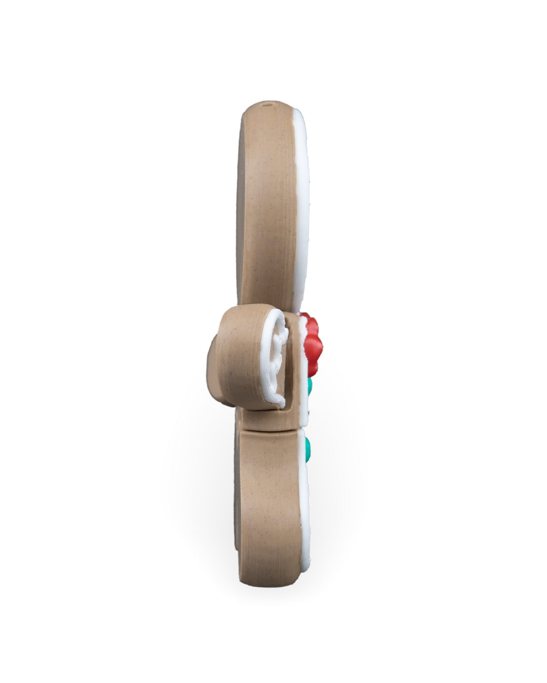 Side profile of the gingerbread man Christmas ornament, on a white background