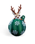Lying Reindeer Christmas ornament, 3D printed, front view: tan reindeer with brown antlers lying on a green ball with white snowflakes, on a white background
