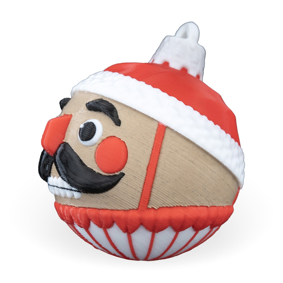 Side profile of the Nutcracker Christmas ornament with red nose, red hat and printed top loop, on a white background