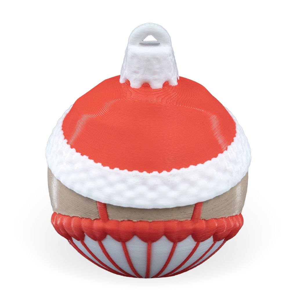 Back of the Nutcracker Christmas ornament with red hat, white fur trim and printed hanging loop, on a white background