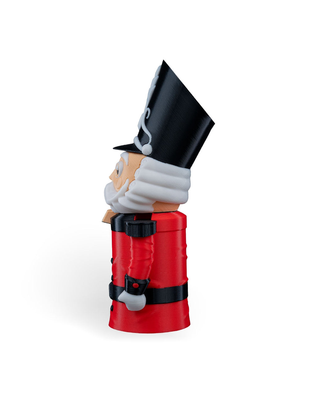 Side profile of the Nutcracker Soldier Christmas ornament with tall black hat and red coat, on a white background