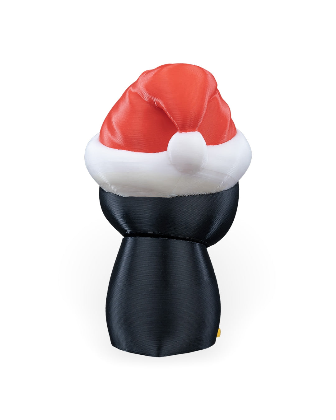 Back of the Penguin in Santa Hat Christmas ornament showing the Santa hat's white pom-pom, on a white background
