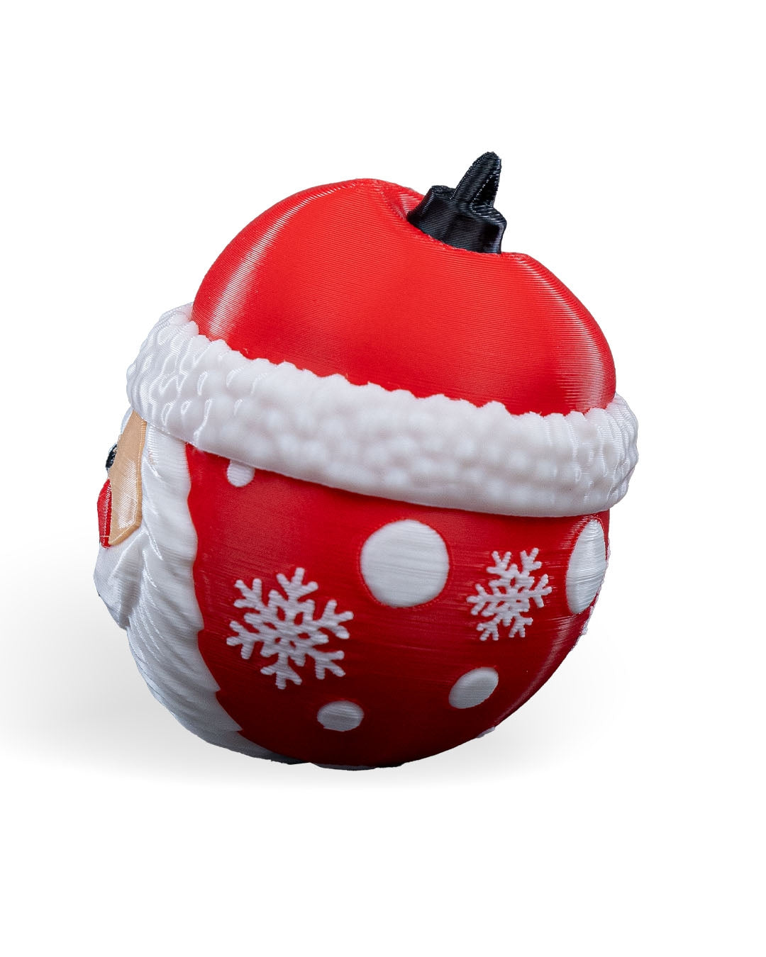 Santa Face Christmas ornament angled from the back, showing the hat trim and snowflake pattern, on a white background