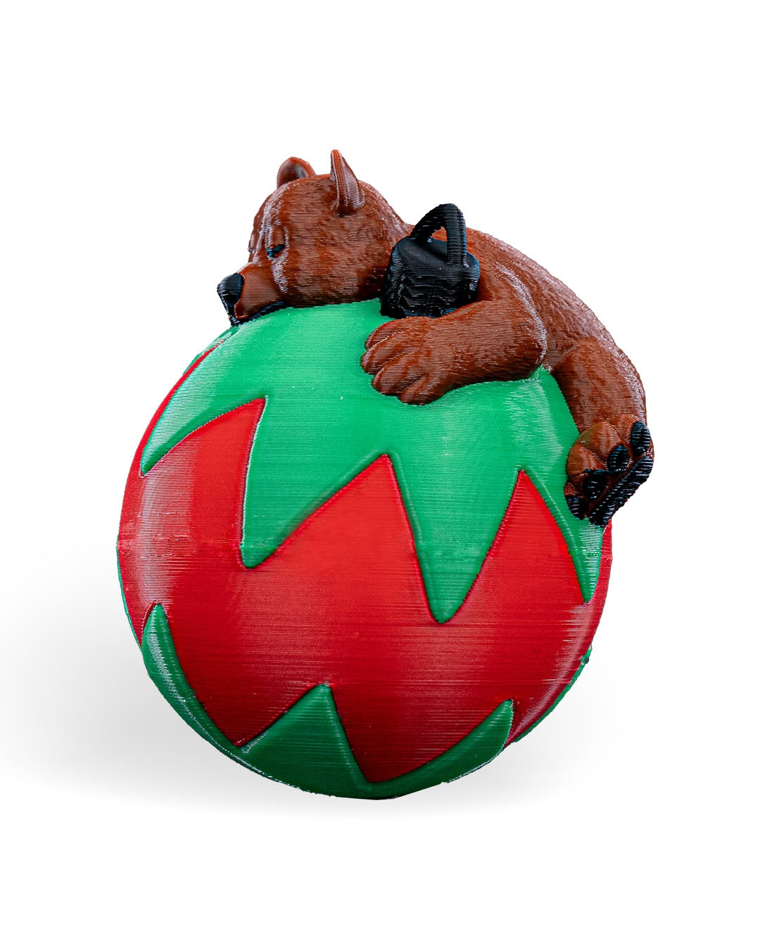 Sleeping Bear Christmas ornament angled to show the bear's face and the black printed hanging loop, on a white background