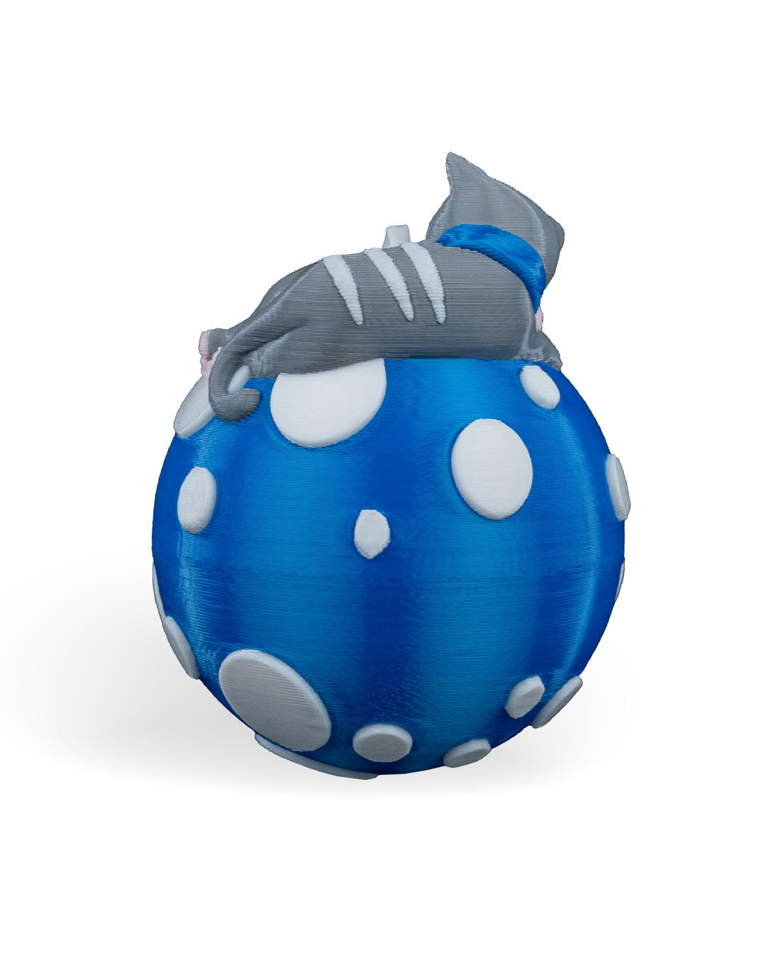 Back of the Sleeping Cat Christmas ornament showing the striped kitten draped over the polka-dot ball, on a white background