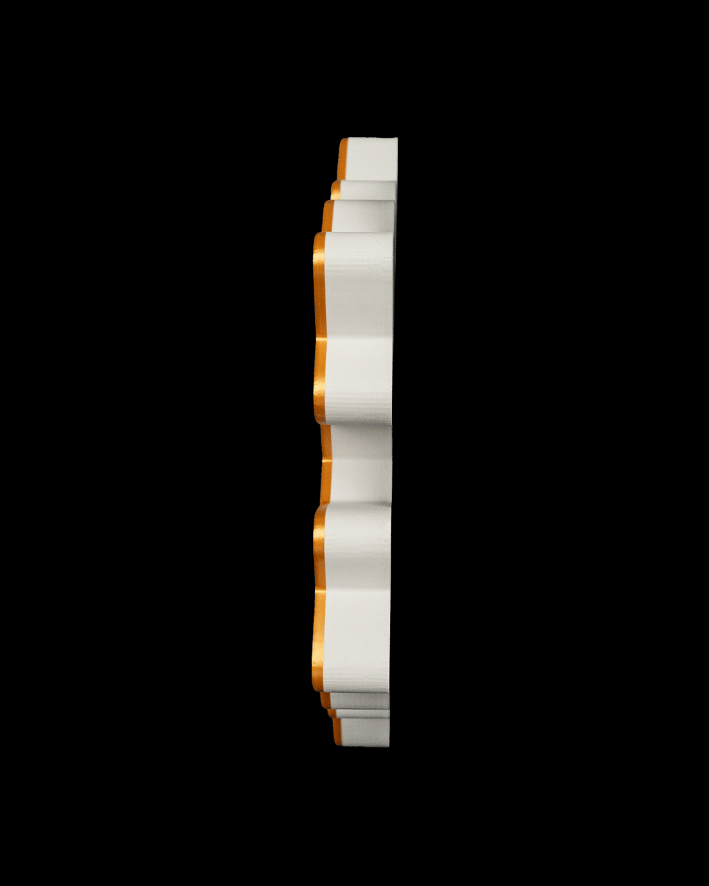 Edge view of the snowflake tray showing its low profile, on a black background