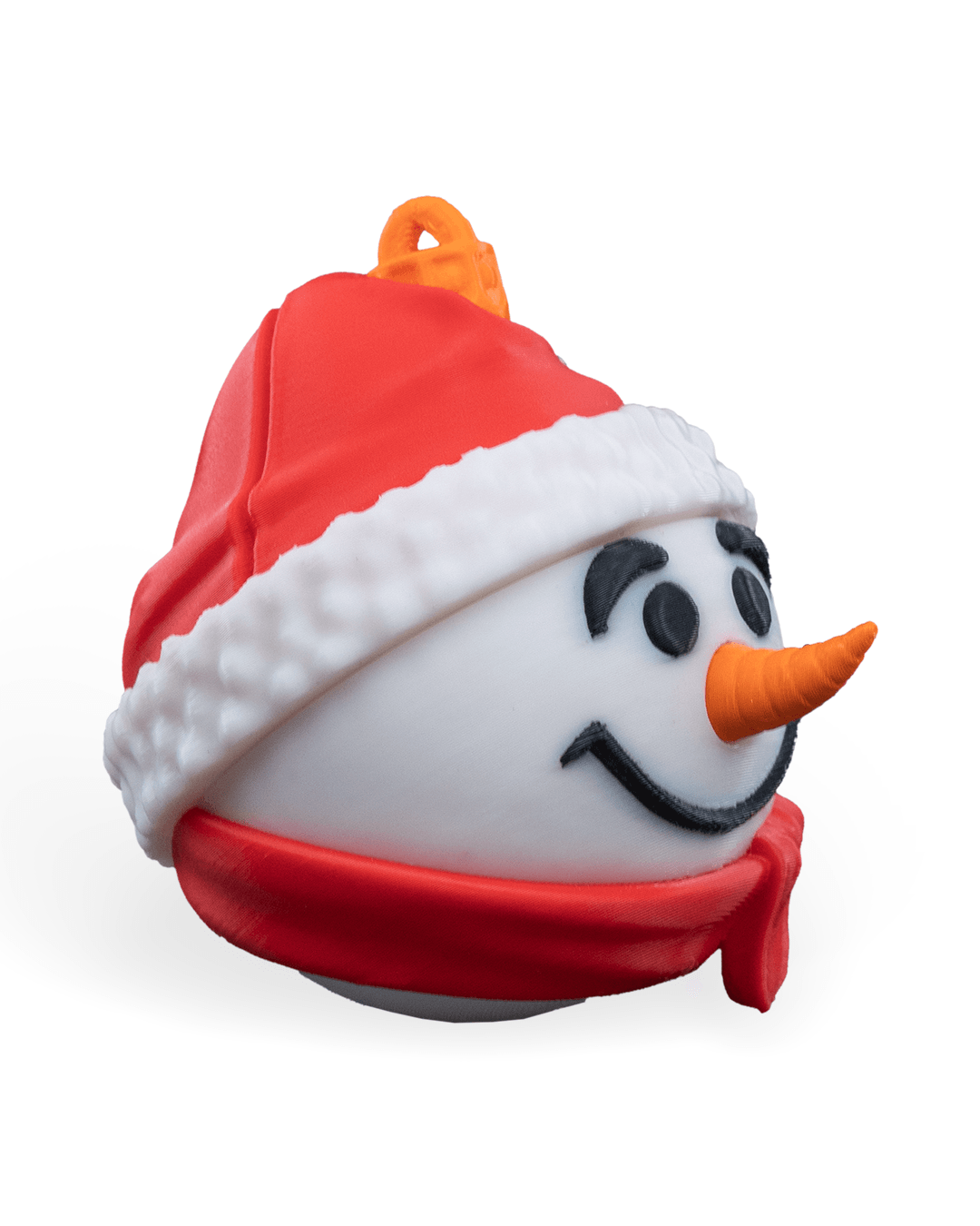 Snowman Christmas ornament turned to the right, showing the carrot nose, red scarf and printed hanging loop, on a white background