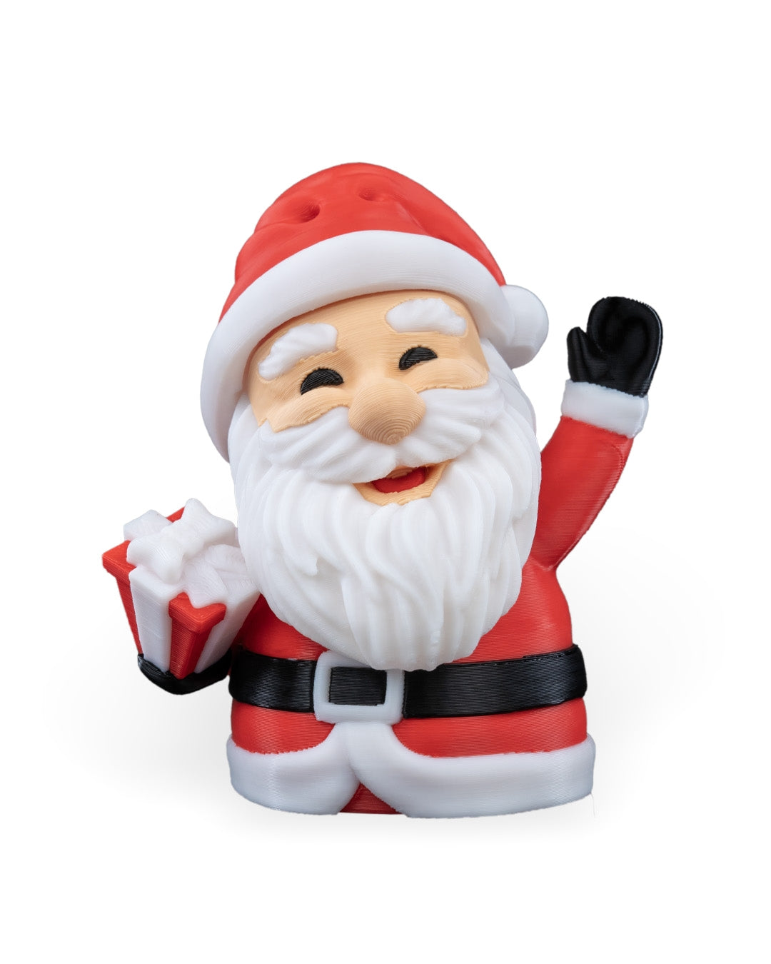 Waving Santa Christmas ornament, 3D printed, front view: red hat, white beard, black glove raised in a wave, holding a wrapped gift, on a white background