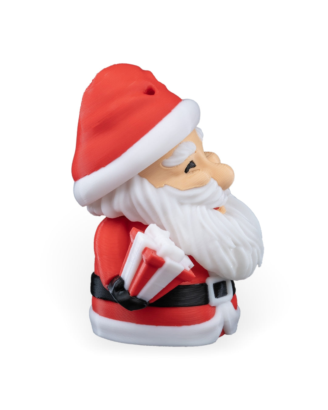 Waving Santa Christmas ornament angled from the left, showing the wrapped gift and black belt, on a white background