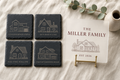 Welcome Set gift bundle — four monogrammed slate coasters and personalized acrylic welcome plaque with brass easel